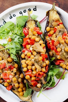 chickpea stuffed aubergines on a white plate 