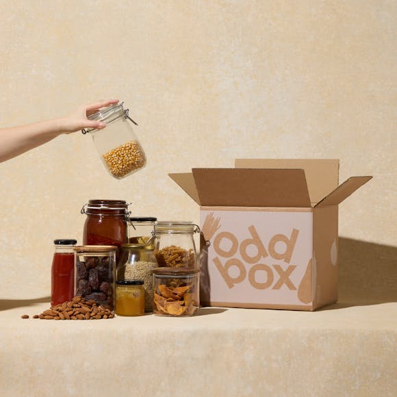 Loose pantry items, such as rice, in jars next to an Oddbox.