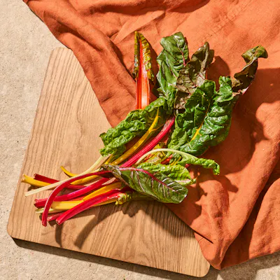 Rainbow chard on a chopping board.