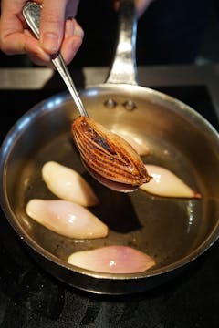 A shallot that's been caramelised and browned on the bottom.