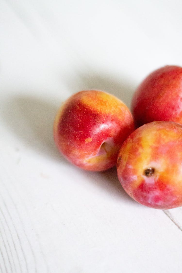 Three apples on a table