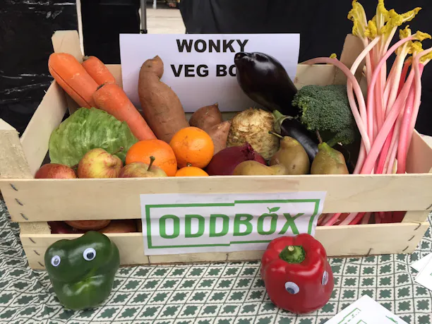 an original oddbox, a wooden crate filled with fruit and veg
