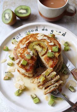 kiwi pancakes on a white plate