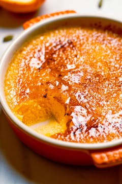 whole Seville Orange & Cardamom Crème Brûlée in a dish with a scope missing