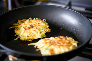 two fritters in a pan 