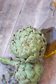 two whole globe artichoke