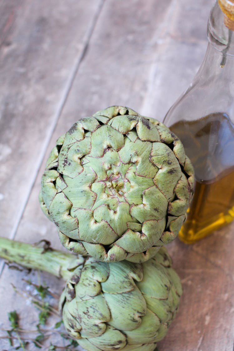 two whole globe artichoke
