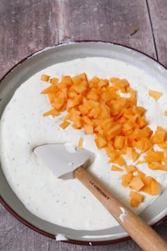 chopped melon added to wet cream mixture