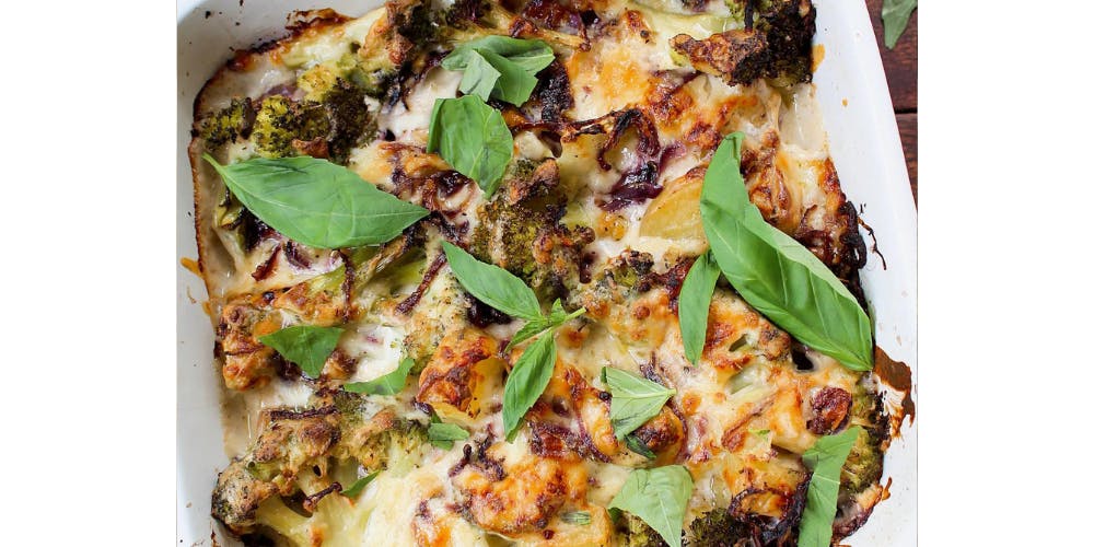 broccoli traybake topped with fresh basil 