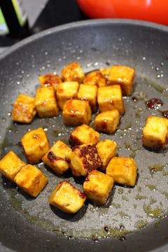 tofu cooked in frying pan 