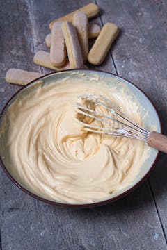 bowl of cream and whisk