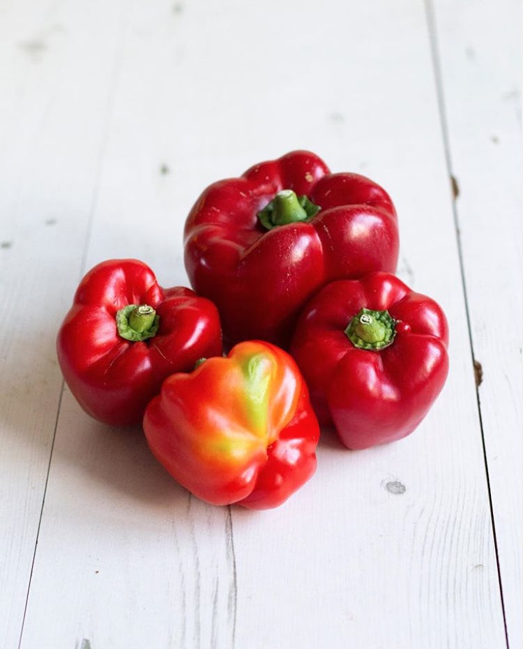 four odd red bell peppers
