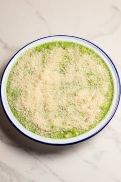 prepared mac and cheese covered in breadcrumbs ready to go in the oven