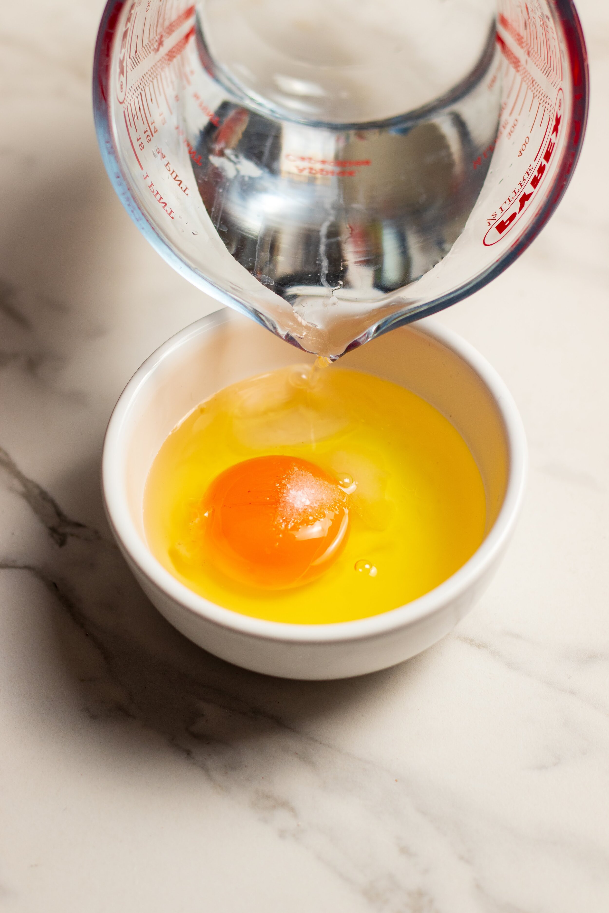one cracked egg in a bowl