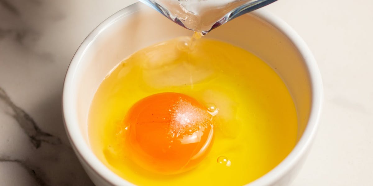 one cracked egg in a bowl
