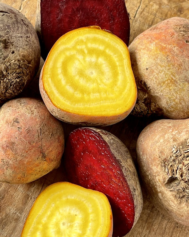 Red and yellow beetroot cut open