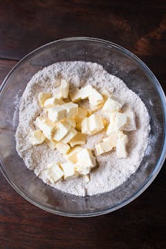 dried ingredients and butter in mixing bowl