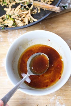 chilli oil in small bowl with spoon