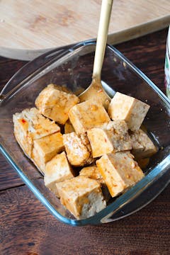 tofu cubes in a clear dish