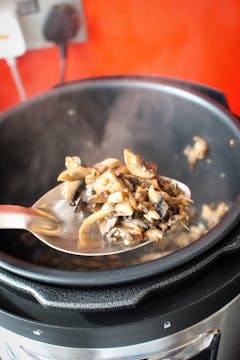 cooked mushrooms on a spoon