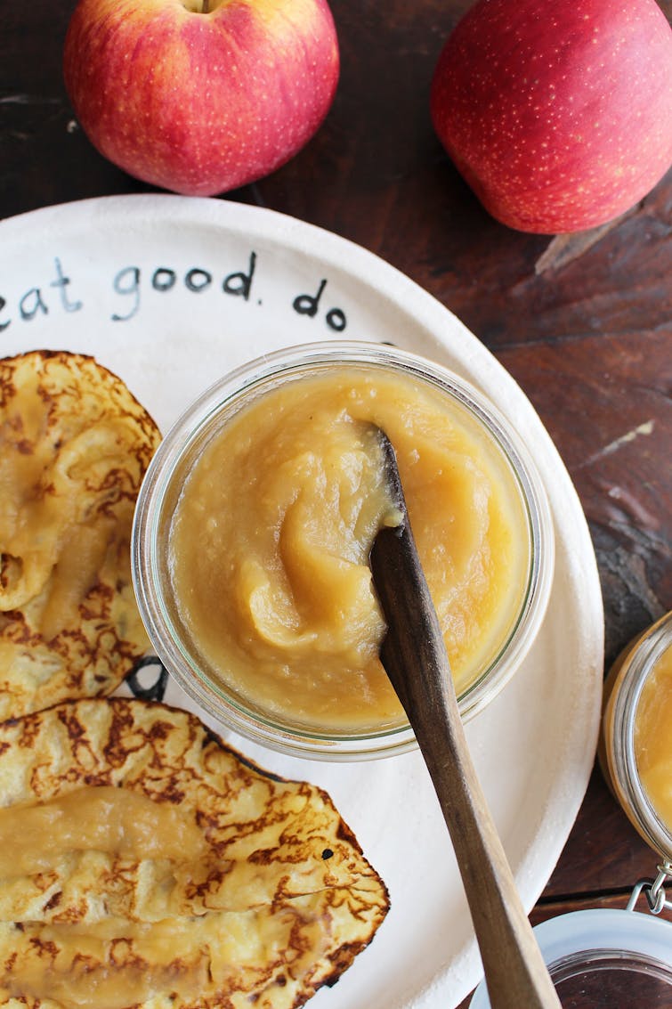 maple apple butter in serving jar with pancakes on the side