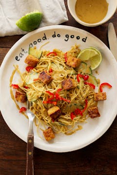 crispy tofu with satay cabbage on a white plate