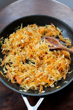 mooli radish, carrots and tofu in a frying pan