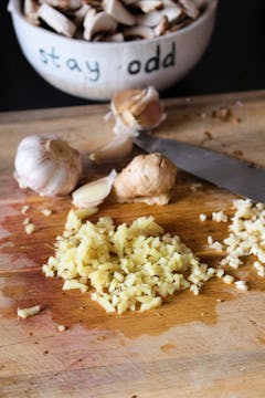 ginger and garlic on a chopping board