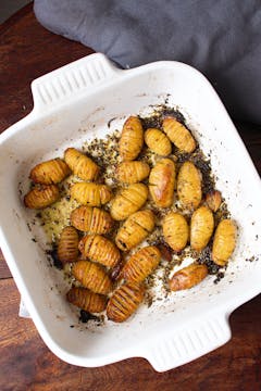 Cooked potatoes in roasting pan