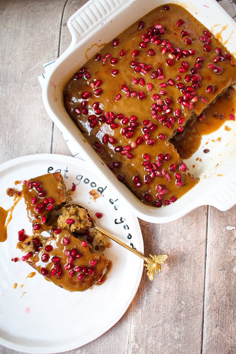 sticky toffee and pomegranate pudding served on a plate