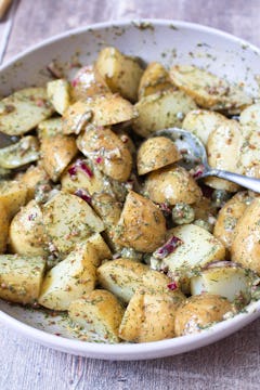 image of potatoes mixed with dressing