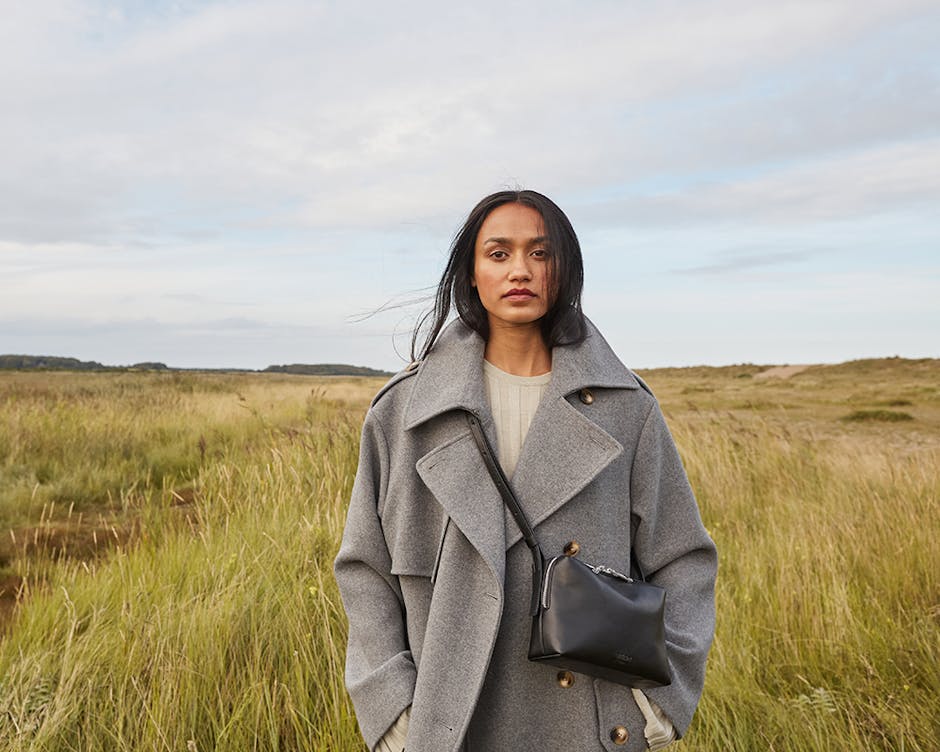 BEEN London bag worn by woman in a field