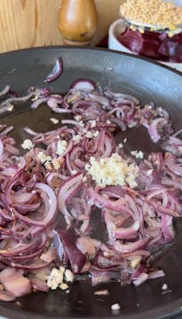 onions being caramelised in a saucepan 