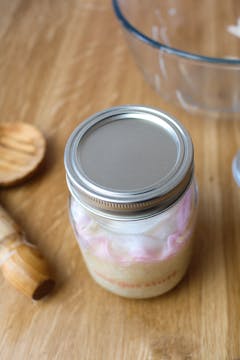 glass jar with fermented mooli radish inside