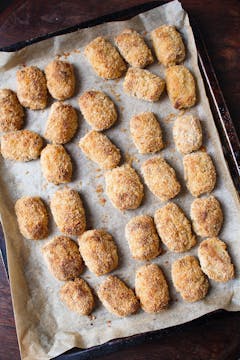 potato croquettes on lined baking tray cooked