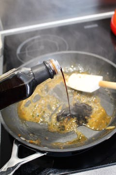 Balsamic vinegar deglazing a pan to make a reduction. 
