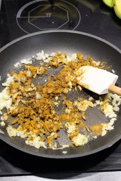 spices added to the pan with onion
