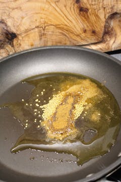 spices cooking in frying pan