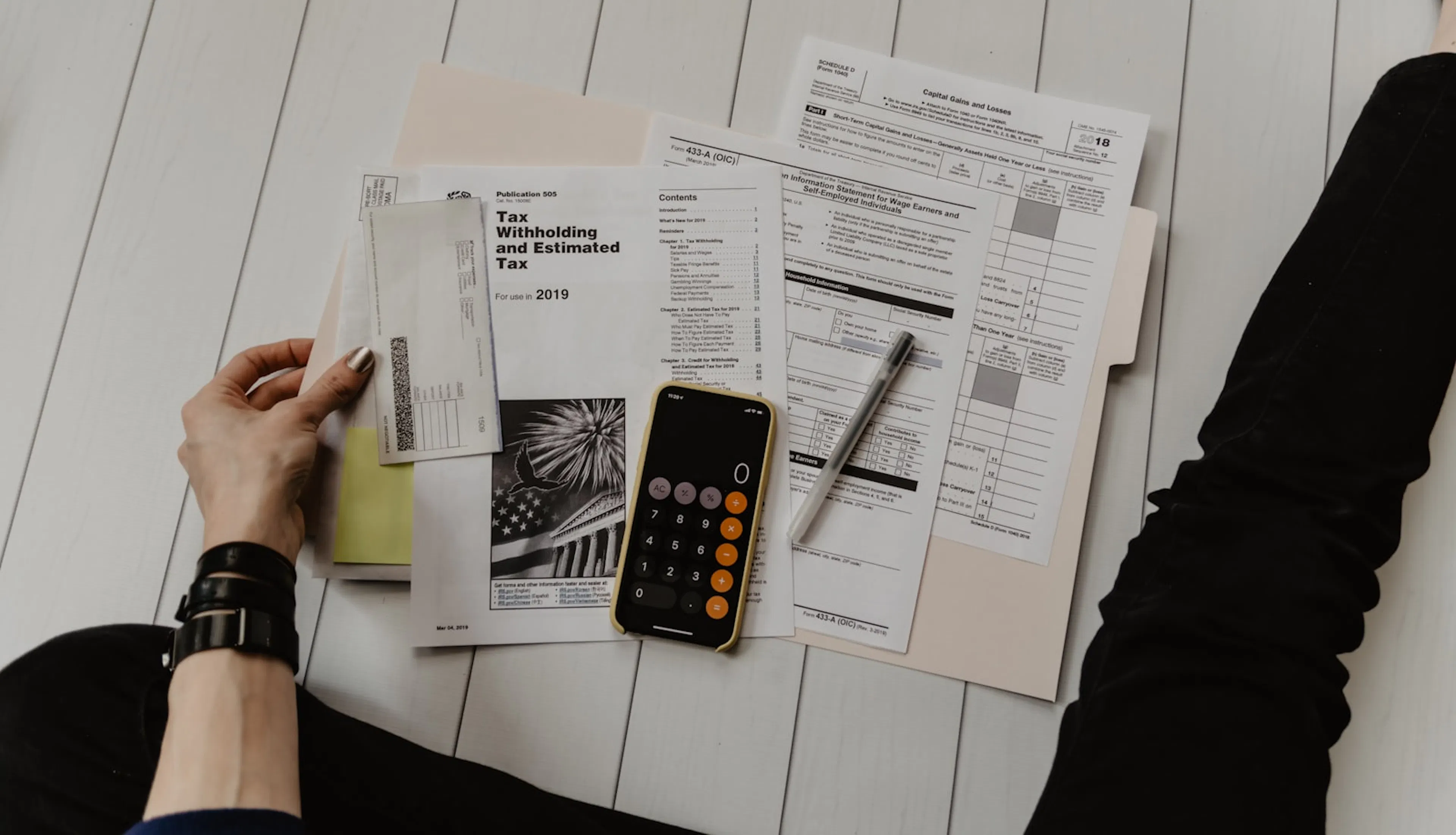 Calculator and financial paperwork on a desk