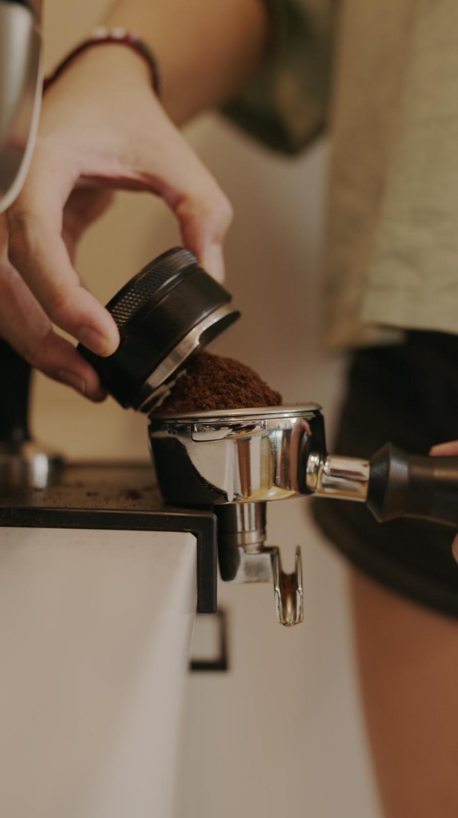 Tamping coffee at Oh! Berry