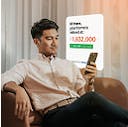 man check home valuation on phone