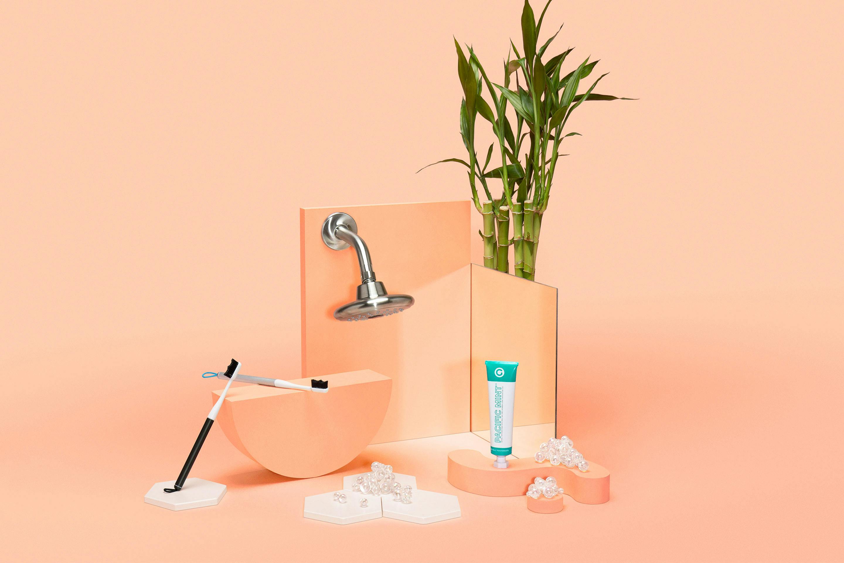 Goodwell products arranged in front of a pink background.