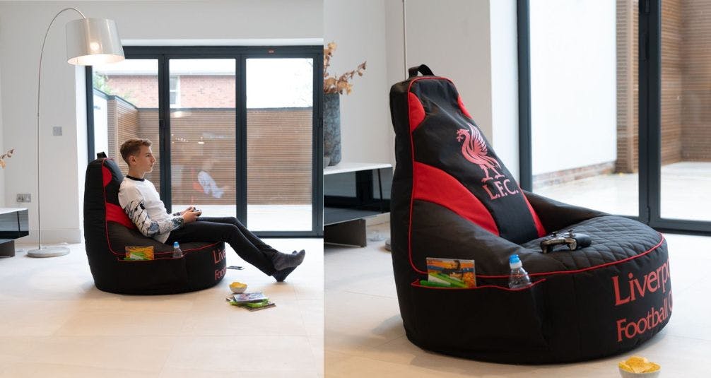 boy playing games on liverpool fc beanbag