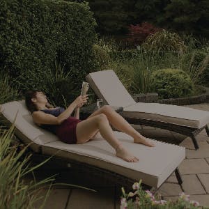 Woman lying on Sun lounger
