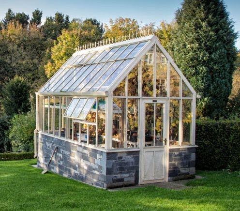 White Greenhouse in garden
