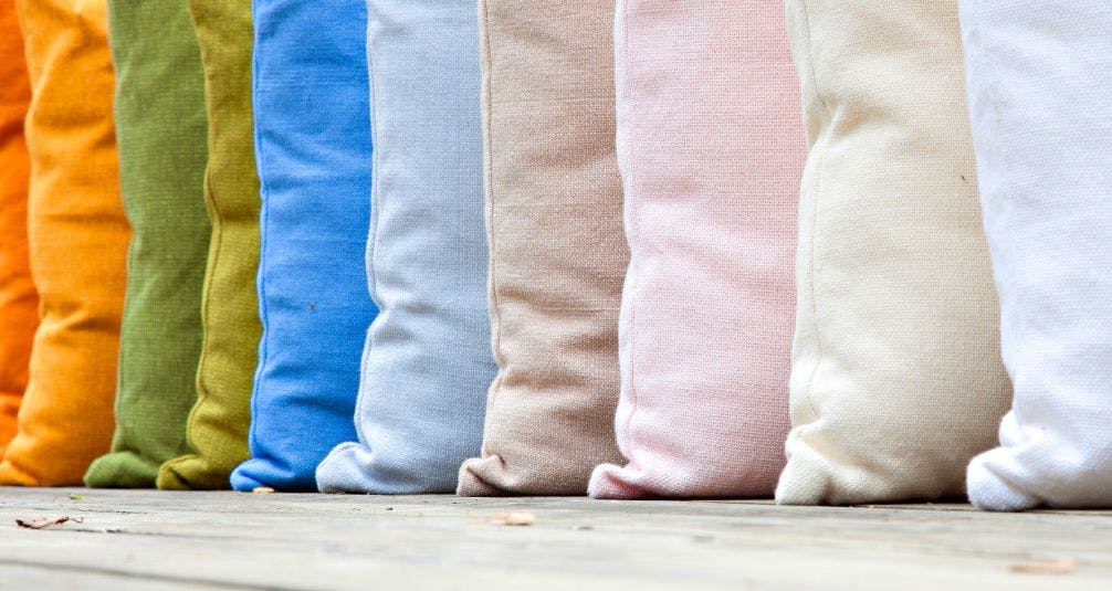 Row of multi coloured outdoor cushions