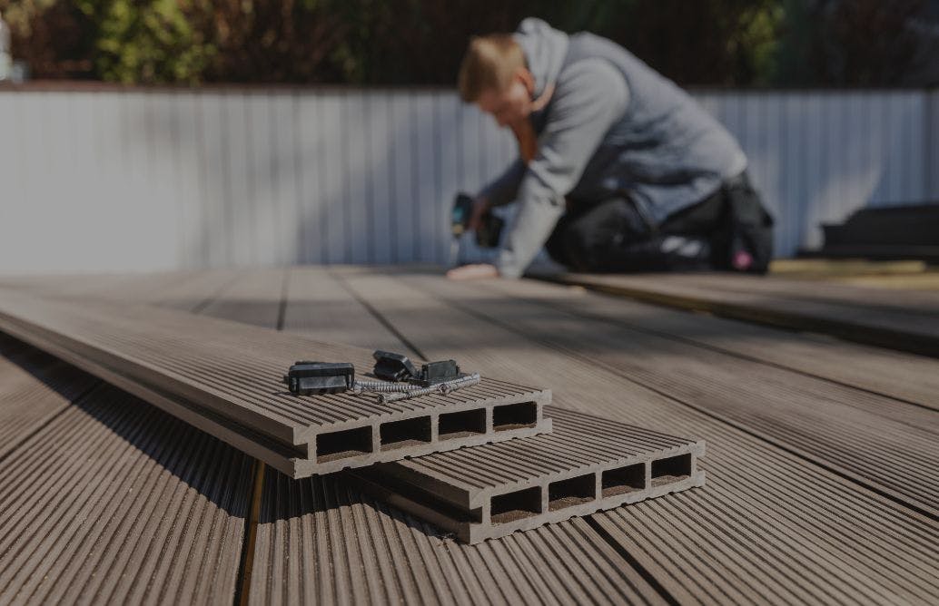 Man installing composite decking