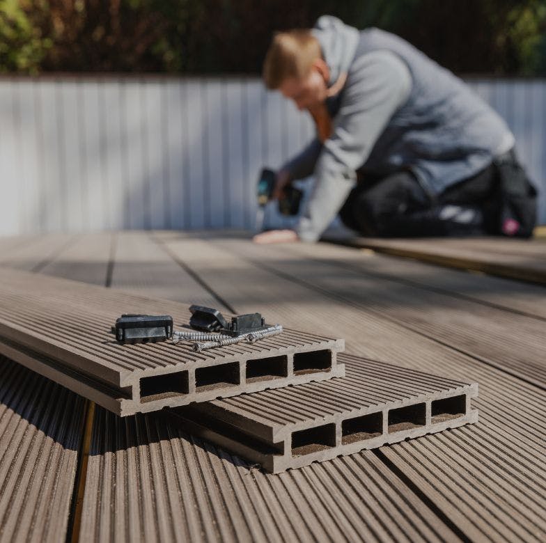 Man installing composite decking