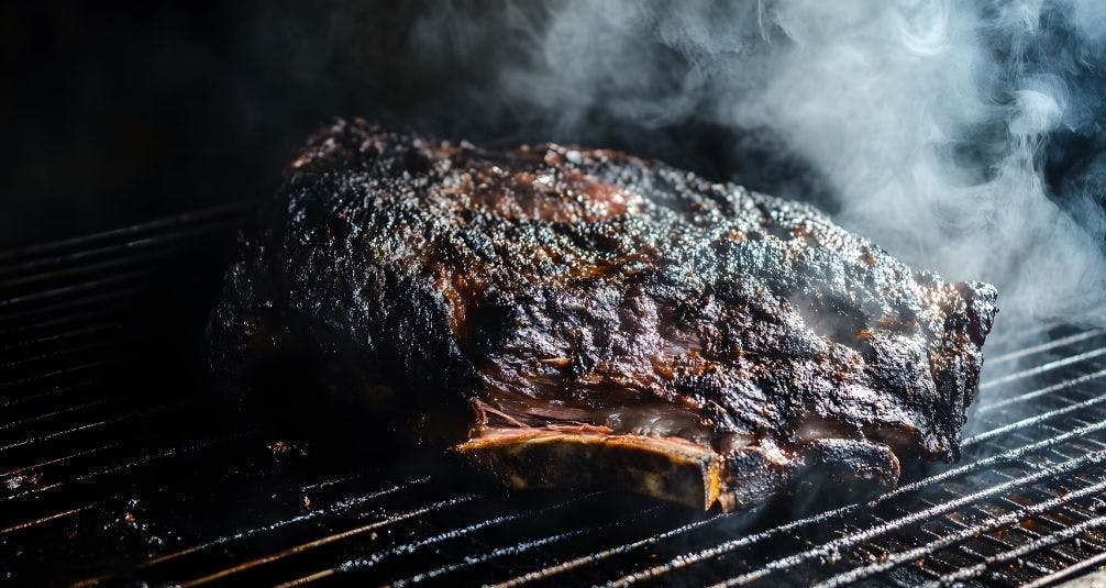 Kamado Grill slow cooked ribs with smoke