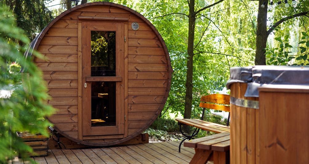 Wooden Barrel Sauna In Garden During Day